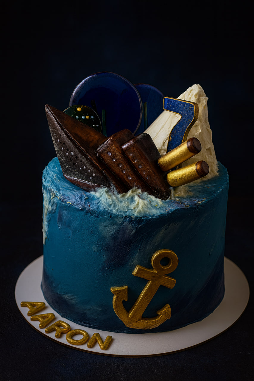 Nautical themed cake with a sinking ship and anchor for Aaron, age 7.